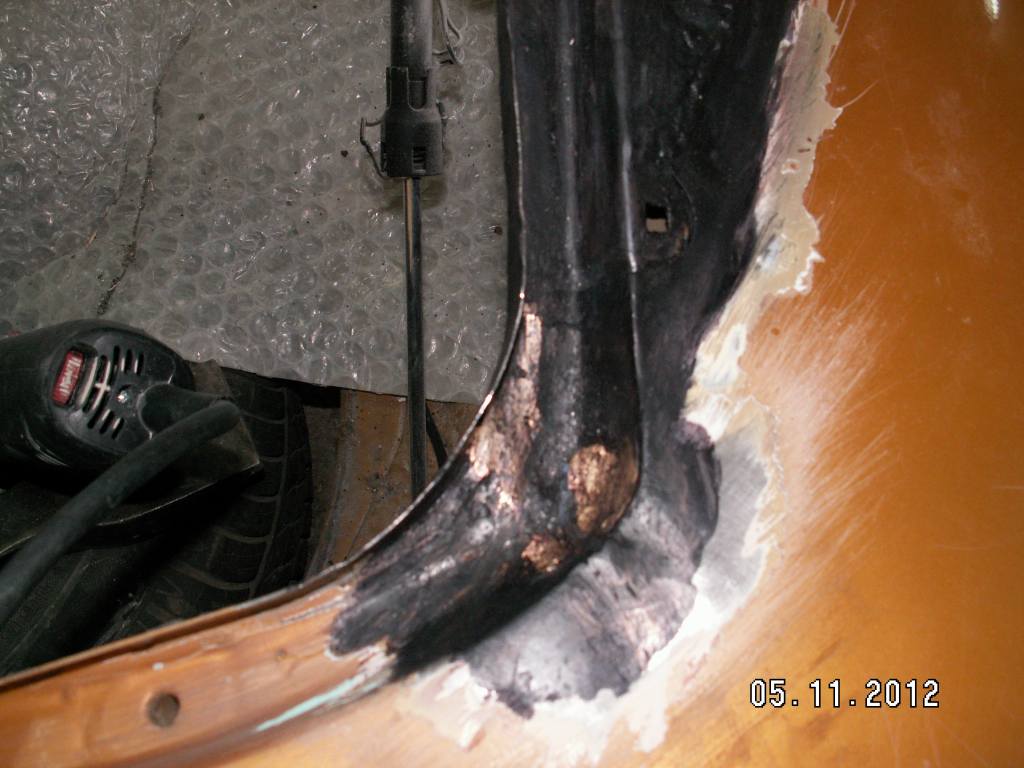 The base of the rear right column after removing the rust and restoring
